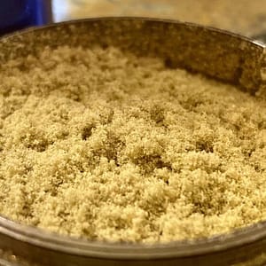 High-potency golden Wholesale THCa Kief in container